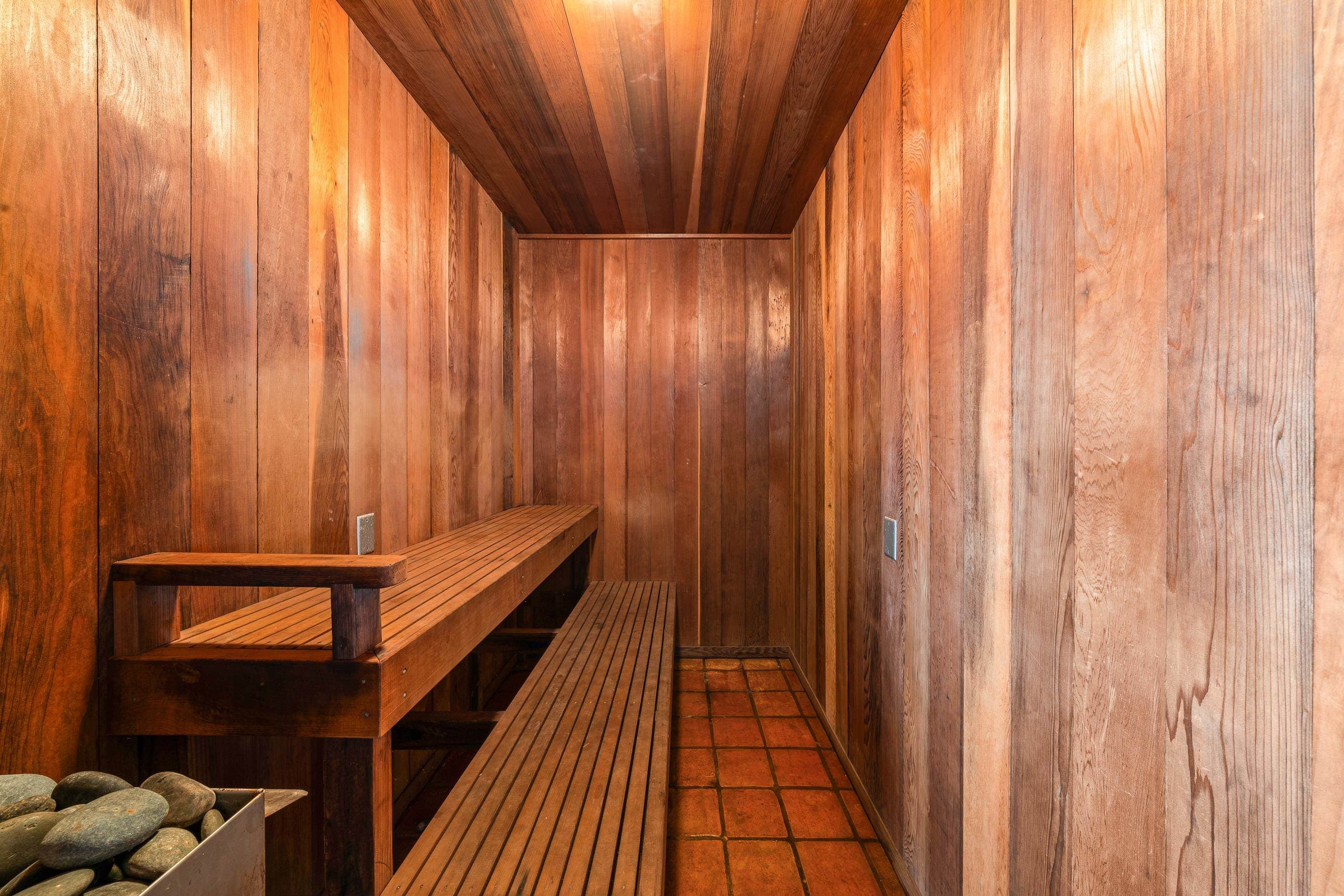 The private cedar sauna, benches warmed and waiting